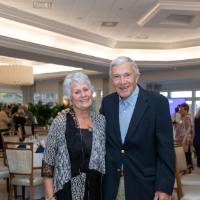 Two event guests smiling at the camera